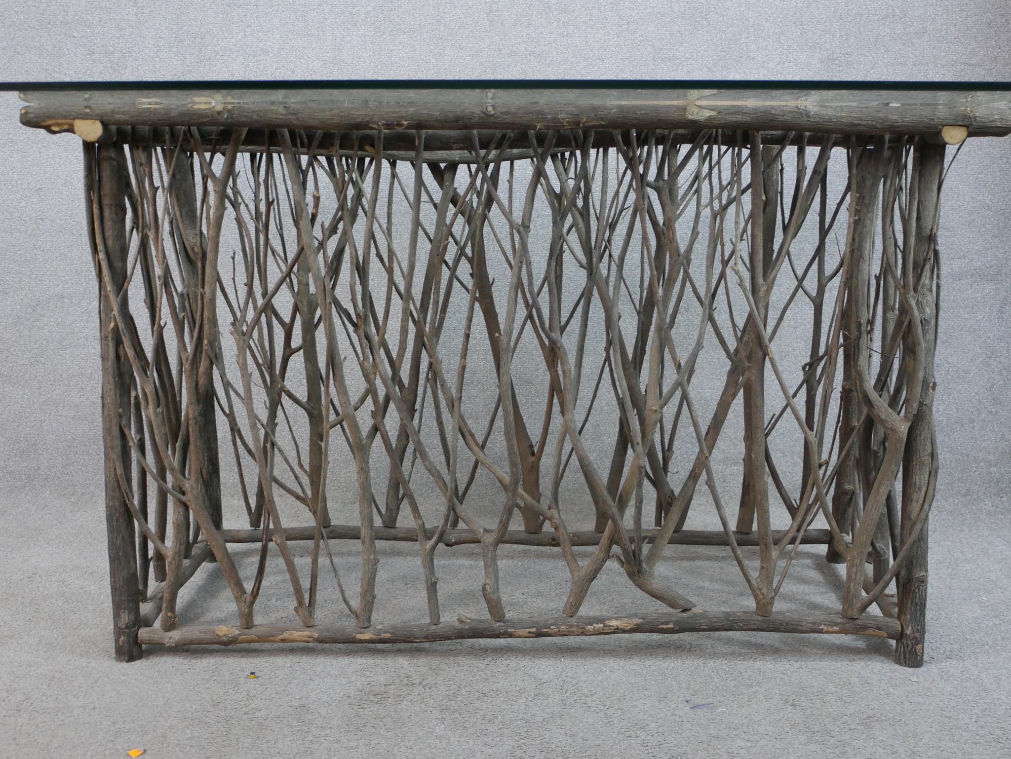 A contemporary glass topped table raised on modernist rectangular twig base. H.77 W.180 D.100cm - Image 2 of 5