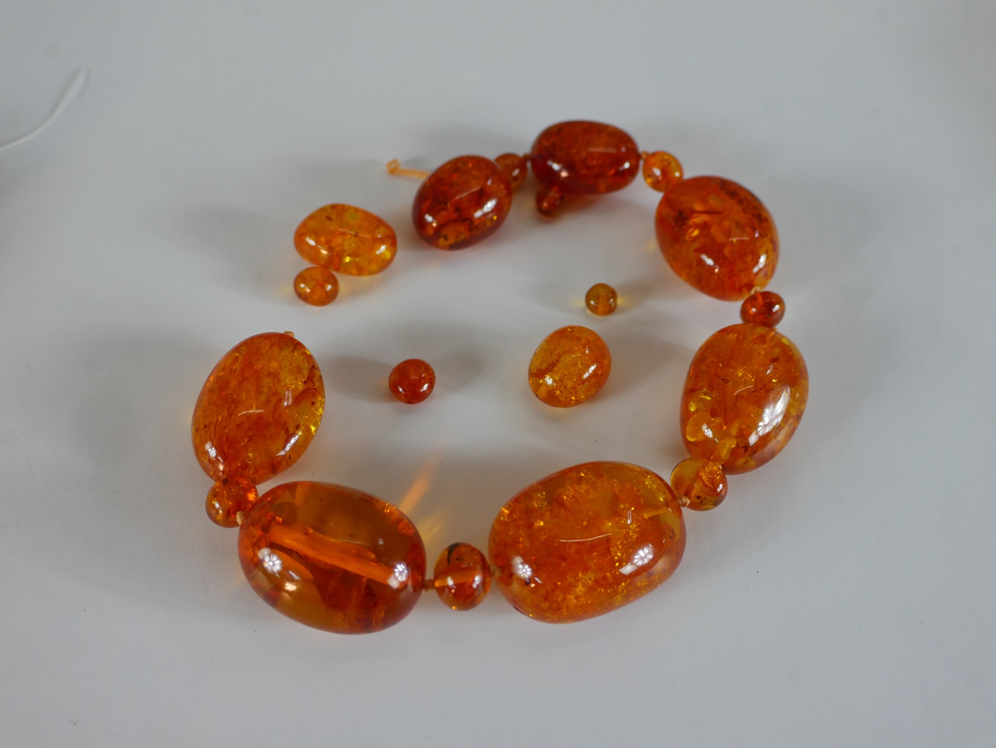 Two strings of amber beads, including a string of large amber beads (measuring 3cm) and smaller - Image 3 of 3