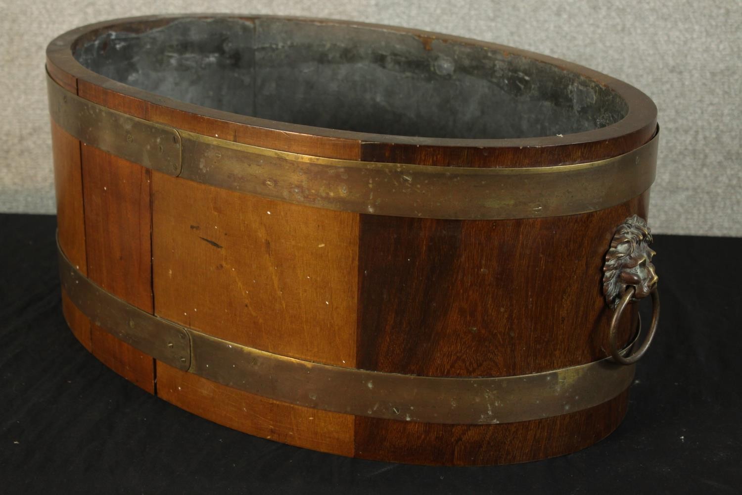 A 20th century Georgian style coopered and brass bound oval wine cooler with twin brass lion mask - Image 3 of 4