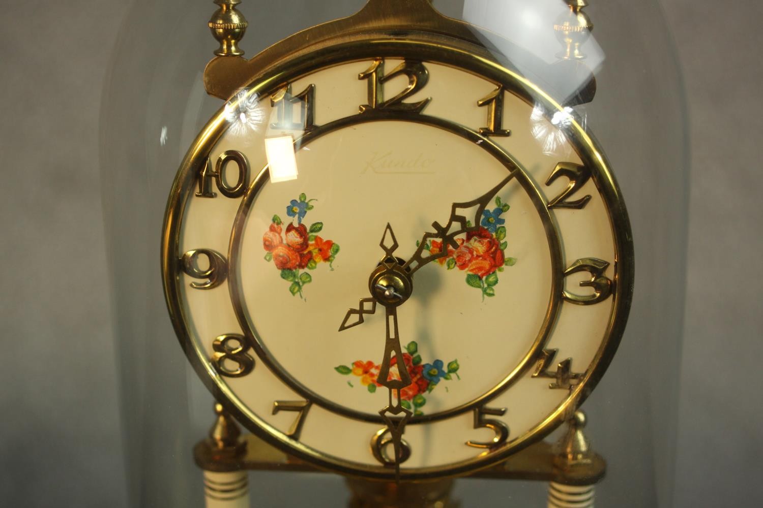 A mid 20th century brass anniversary clock, the white dial painted with floral panel and Arabic - Image 3 of 4