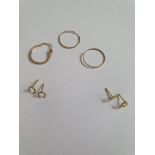 Three pairs of 9ct gold earrings and a single engraved 9ct rose gold hoop earring. The two pairs