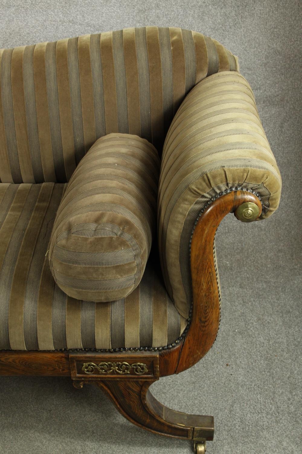 A Regency rosewood framed scroll arm settee upholstered in brown fabric, raised on four outswept - Image 5 of 10