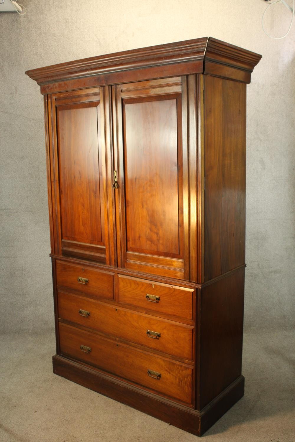 A 19th century mahogany twin door linen press opening to reveal three slides raised on two short - Image 5 of 6