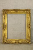 A 19th/ early 20th century Rococo style rectangular gilt frame. H.120 W.100cm.