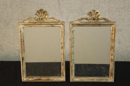 A pair of contemporary white painted Italian style rectangular mirrors carved with shell decoration.