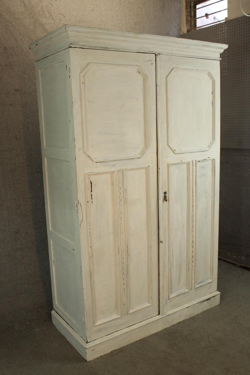 A 1930s white painted oak twin door gentlemen's wardrobe opening to reveal fitted interior raised on - Image 3 of 5