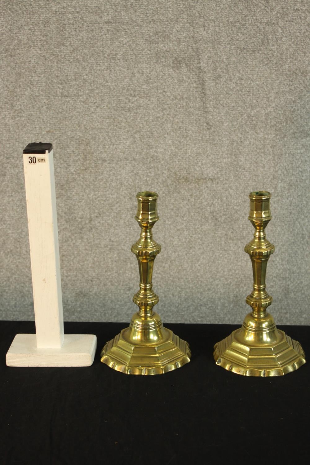 A pair of French Louis XV brass octagonal candlesticks raised on octagonal bases. H.24cm. - Image 2 of 2