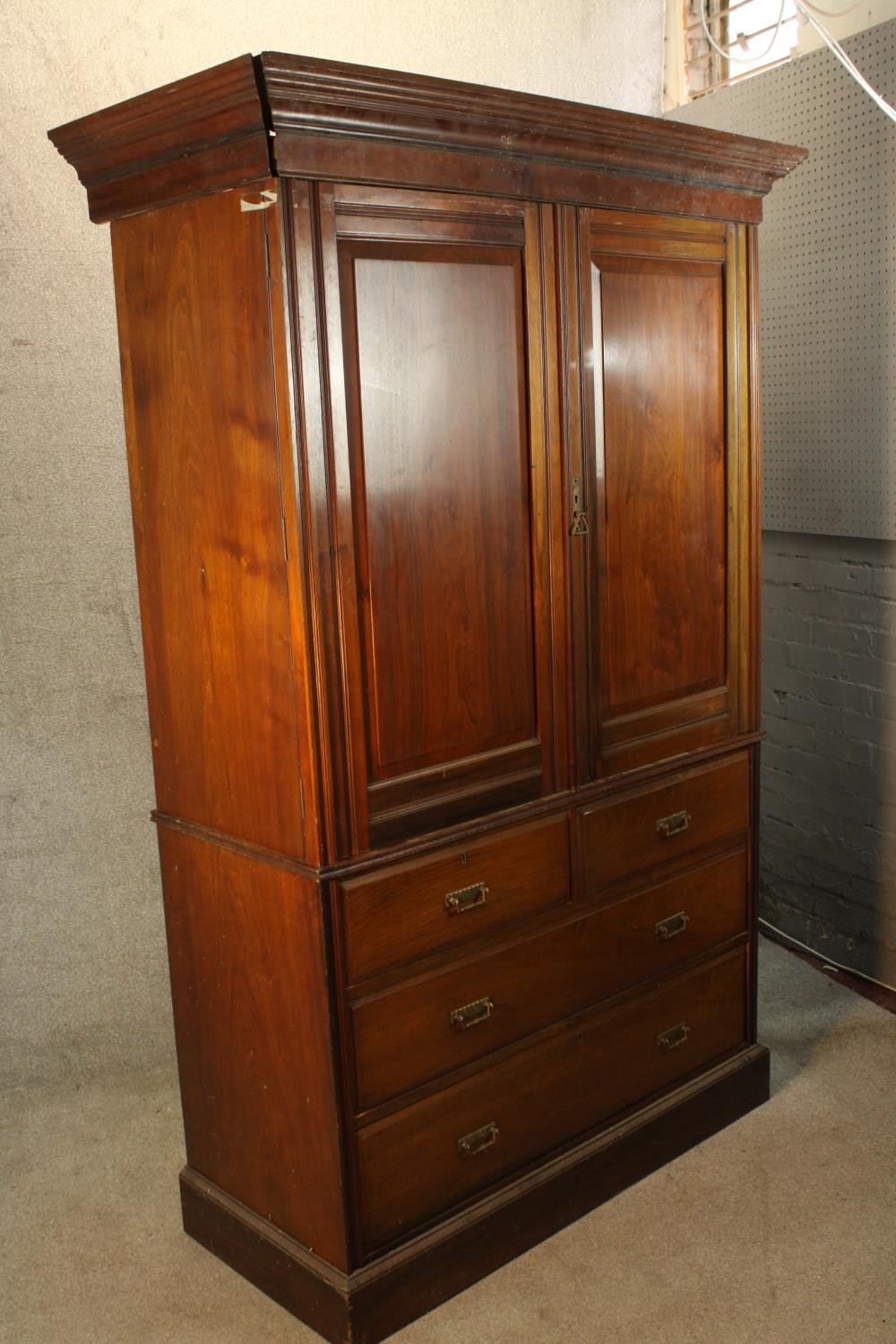 A 19th century mahogany twin door linen press opening to reveal three slides raised on two short - Image 6 of 6