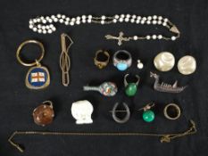 A collection of costume jewellery, including a Thai niello silver brooch of a royal barge, a Max