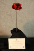 Blood Swept Lands and Seas of Red, a limited edition ceramic poppy by Paul Cummins made for the