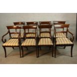 A set of eight Regency mahogany framed bar back dining chairs comprised of six singles and two