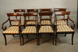 A set of eight Regency mahogany framed bar back dining chairs comprised of six singles and two