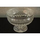 A 19th century, possibly Irish, diamond cut glass footed bowl raised on fluted circular foot. H.20