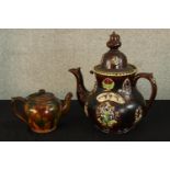 An early 20th century Bargeware style teapot and cover together with a smaller 20th century 20th