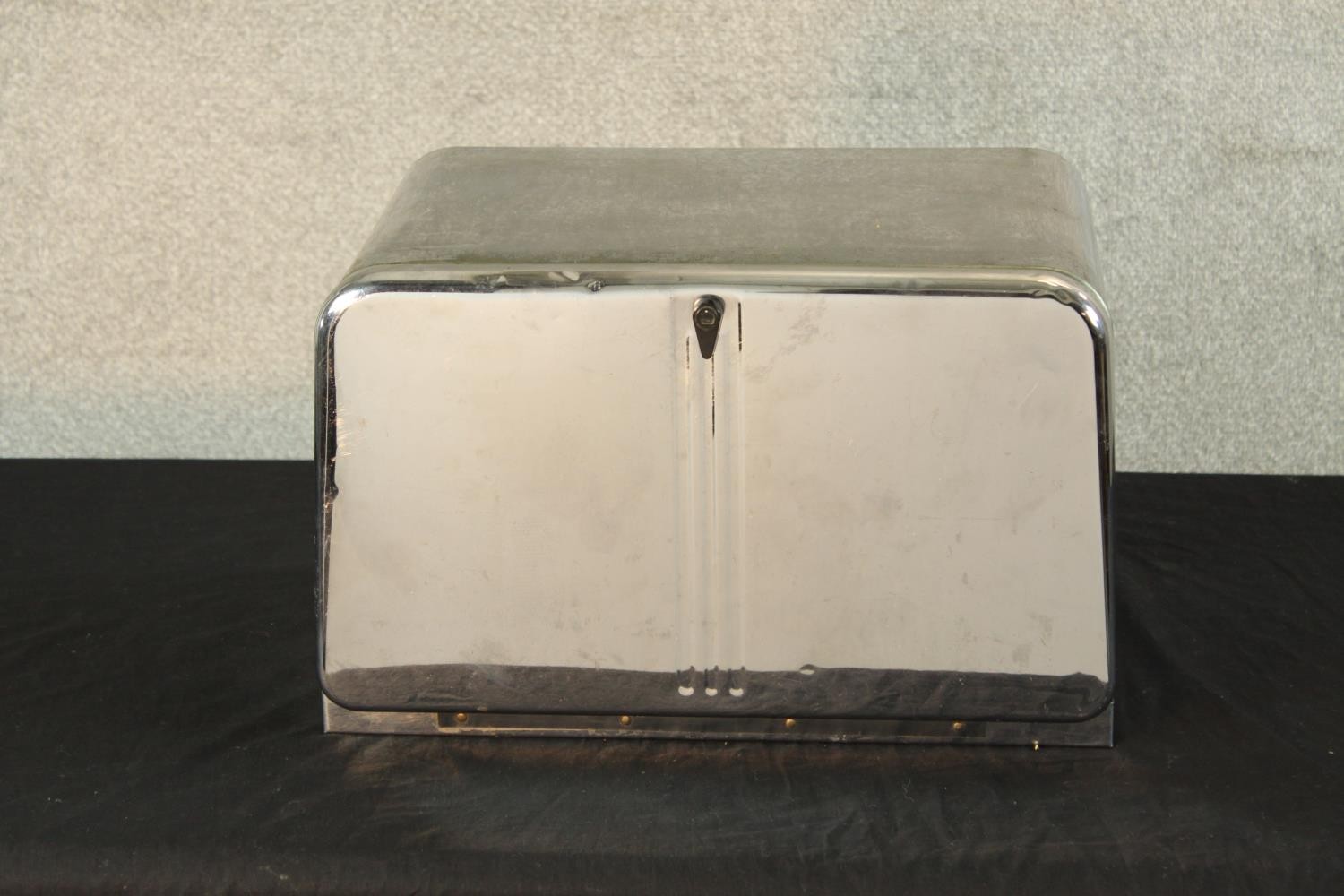 A mid 20th century chrome plated bread storage bin with internal shelf, vent holes and front