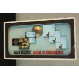 Mark Knopfler, Sailing to Philadelphia, a cased platinum disc presentation diorama. H.80 W.42cm.