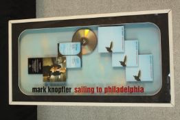 Mark Knopfler, Sailing to Philadelphia, a cased platinum disc presentation diorama. H.80 W.42cm.