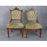 A pair of 19th century Gothic Revival walnut framed button back chairs raised on turned supports