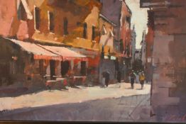 20th century, indistinctly signed, figures standing by a café on the street, oil on board, framed.