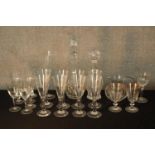 Assorted vintage glassware to include drinking glasses and two decanters and stoppers. H.40cm. (