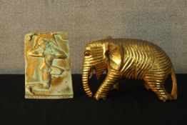 A 20th century Indian gilt wooden standing elephant together with a painted and gilt rectangular