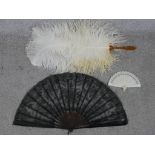 Three assorted 20th century fans to include black lace and plastic fan, a white plastic stick fan