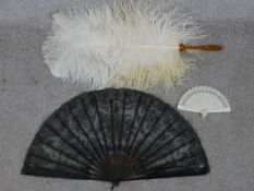 Three assorted 20th century fans to include black lace and plastic fan, a white plastic stick fan
