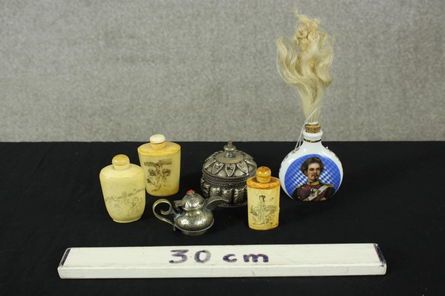 Three 20th century Chinese bone snuff bottles and stoppers, together with a small white metal Indian - Image 2 of 2