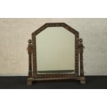 An early 20th century carved oak framed dressing table mirror raised on turned supports. H.59 W.53cm