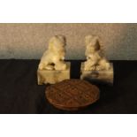 A pair of 20th century carved marble Chinese dogs together with a carved Chinese hardwood printing