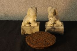 A pair of 20th century carved marble Chinese dogs together with a carved Chinese hardwood printing