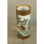 A 19th/early 20th century Chinese porcelain cylindrical stick stand decorated with birds in a