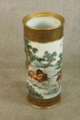 A 19th/early 20th century Chinese porcelain cylindrical stick stand decorated with birds in a