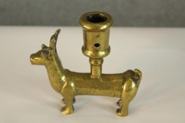 A German, possibly Medieval 15th century small brass zoomorphic candleholder cast in the form of a