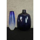 A contemporary, probably Scandinavian blue glass bottle vase together with a mid 20th century blue