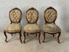 Three 19th century mahogany framed spoon back bedroom chairs in deep buttoned floral upholstery