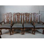 A set of eight mahogany framed pierced splat back dining chairs with stuff over seats raised on