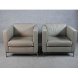 A pair of Walter Knoll 500 grey leather cube chairs designed by Norman Foster raised metal supports,