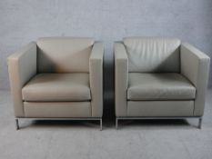 A pair of Walter Knoll 500 grey leather cube chairs designed by Norman Foster raised metal supports,