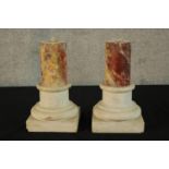 A pair of 19th century carved marble cylindrical marble pillars raised on square plinth bases H.