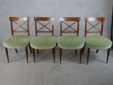 A set of four mahogany Regency 'X' splat back dining chairs with green Dralon stuff over seats