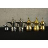 Six contemporary brass and stainless steel Indian coffee pots. H.30cm. (largest)