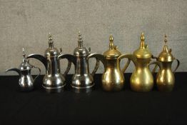 Six contemporary brass and stainless steel Indian coffee pots. H.30cm. (largest)