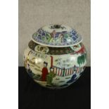 A late 20th century Chinese porcelain jar and cover, decorated with figures in a garden, bearing six