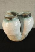 A mid 20th century modernist white and green painted Studio pottery vase. H.37cm.