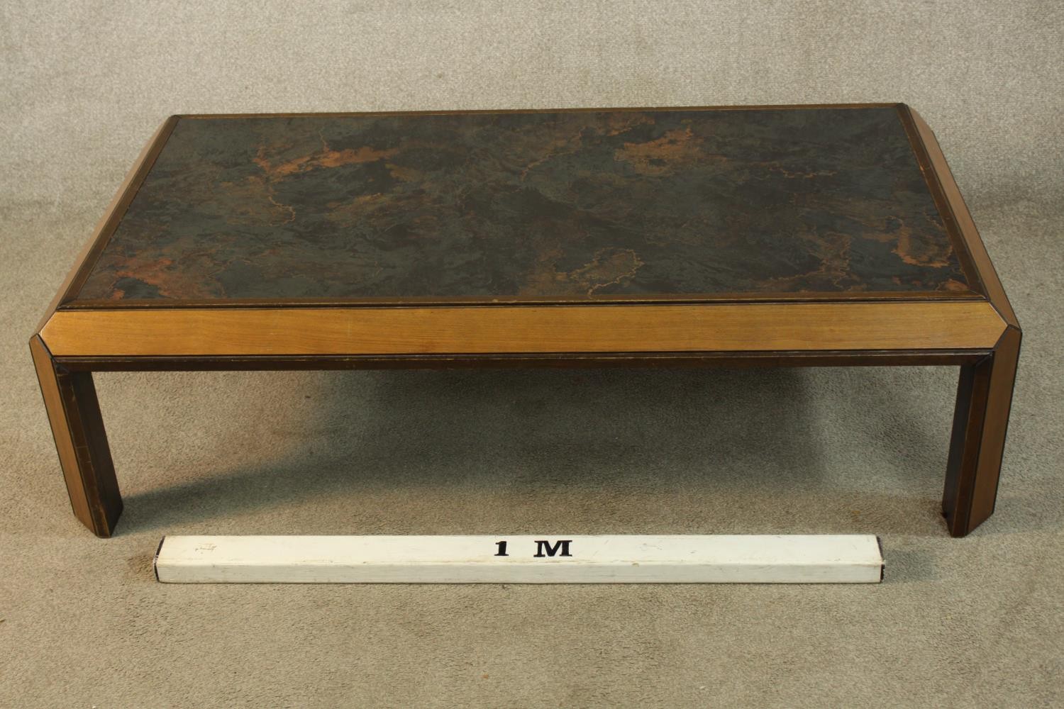 A mid 20th century teak framed coffee table raised on rectangular supports. H.38 W.133 D.74cm. - Image 2 of 4