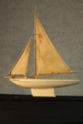 A 20th century painted pond yacht, Endeavor II with canvas sails. H.50 W.40cm.