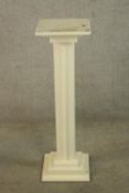 A 20th century white painted pedestal jardinere stand, raised on stepped square base. H.89cm.