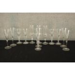 Thirteen assorted 20th century drinking glasses, some with air twist stems. H.21cm. (largest)