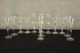 Thirteen assorted 20th century drinking glasses, some with air twist stems. H.21cm. (largest)